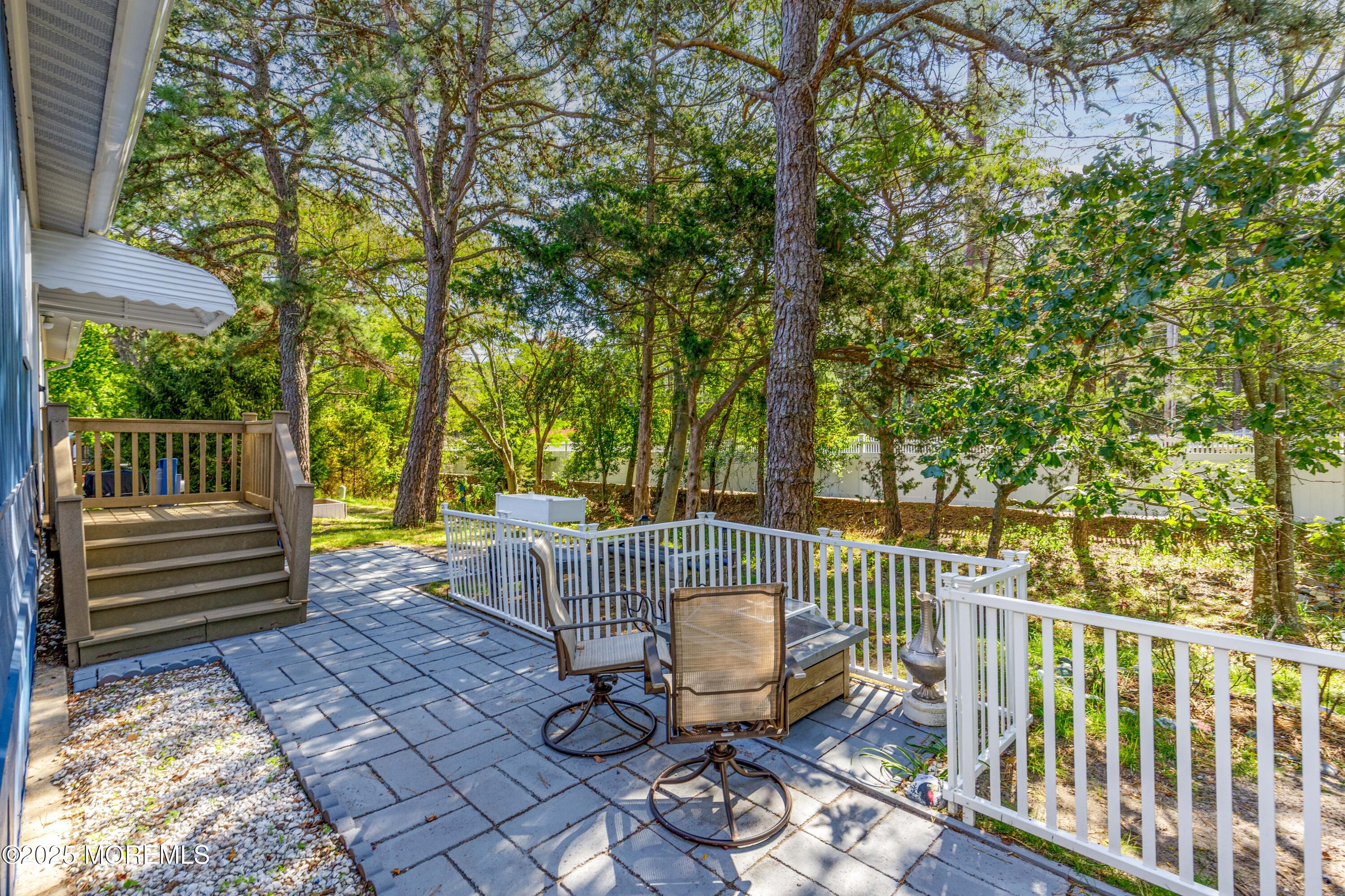 209 Mockingbird Way Whiting, NJ 08759 - Photo 24 of 26 a view of a chair and tables in the deck