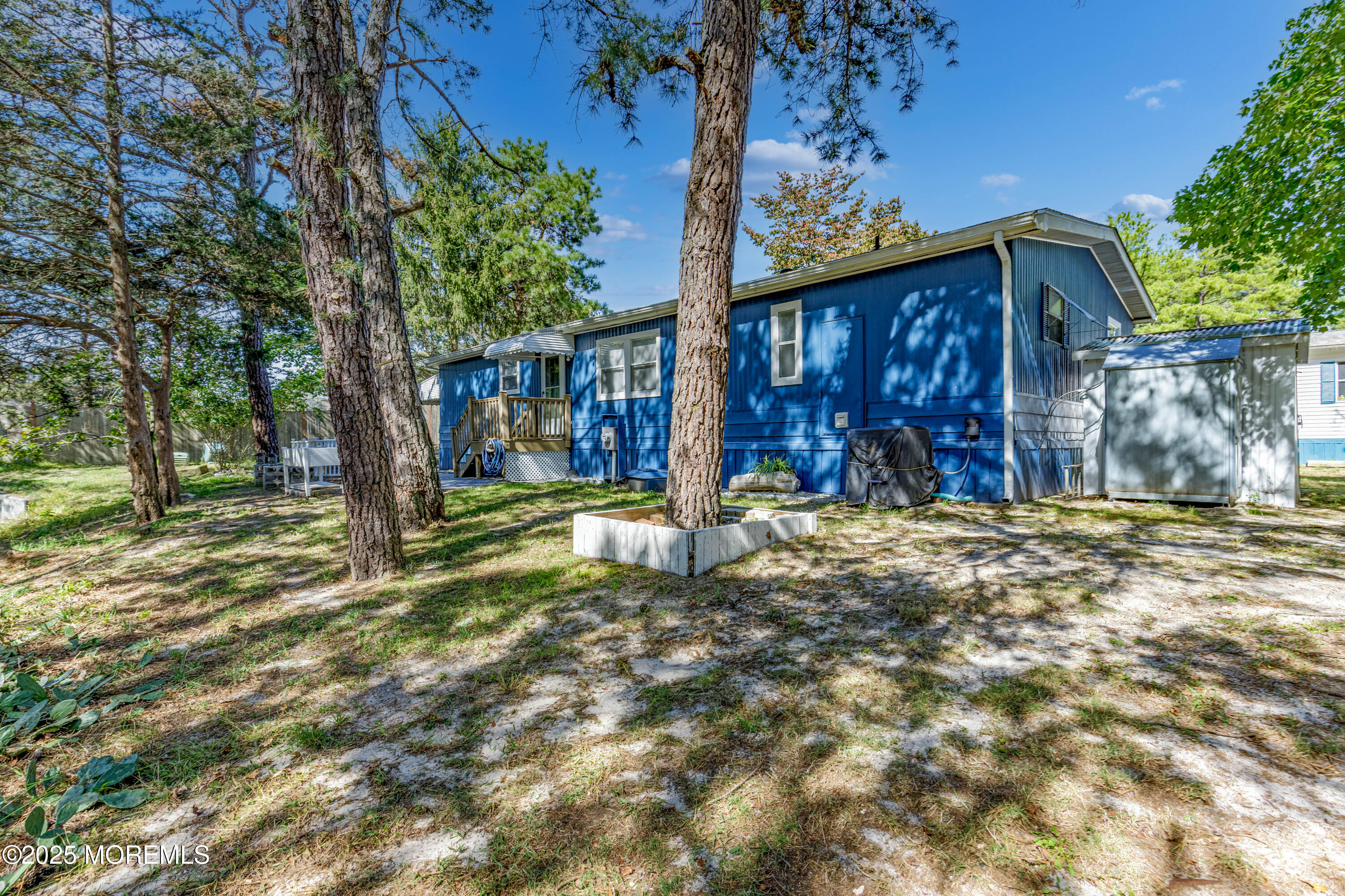 209 Mockingbird Way Whiting, NJ 08759 - Photo 26 of 26 a backyard of a house with barbeque oven and outdoor seating