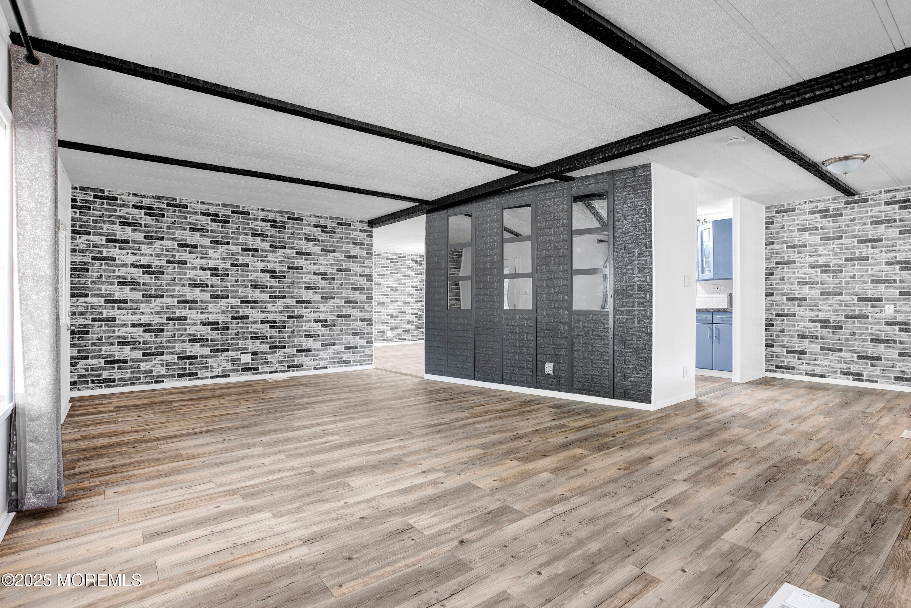 209 Mockingbird Way Whiting, NJ 08759 - Photo 6 of 26 a view of a hallway with wooden floor and a cabinet
