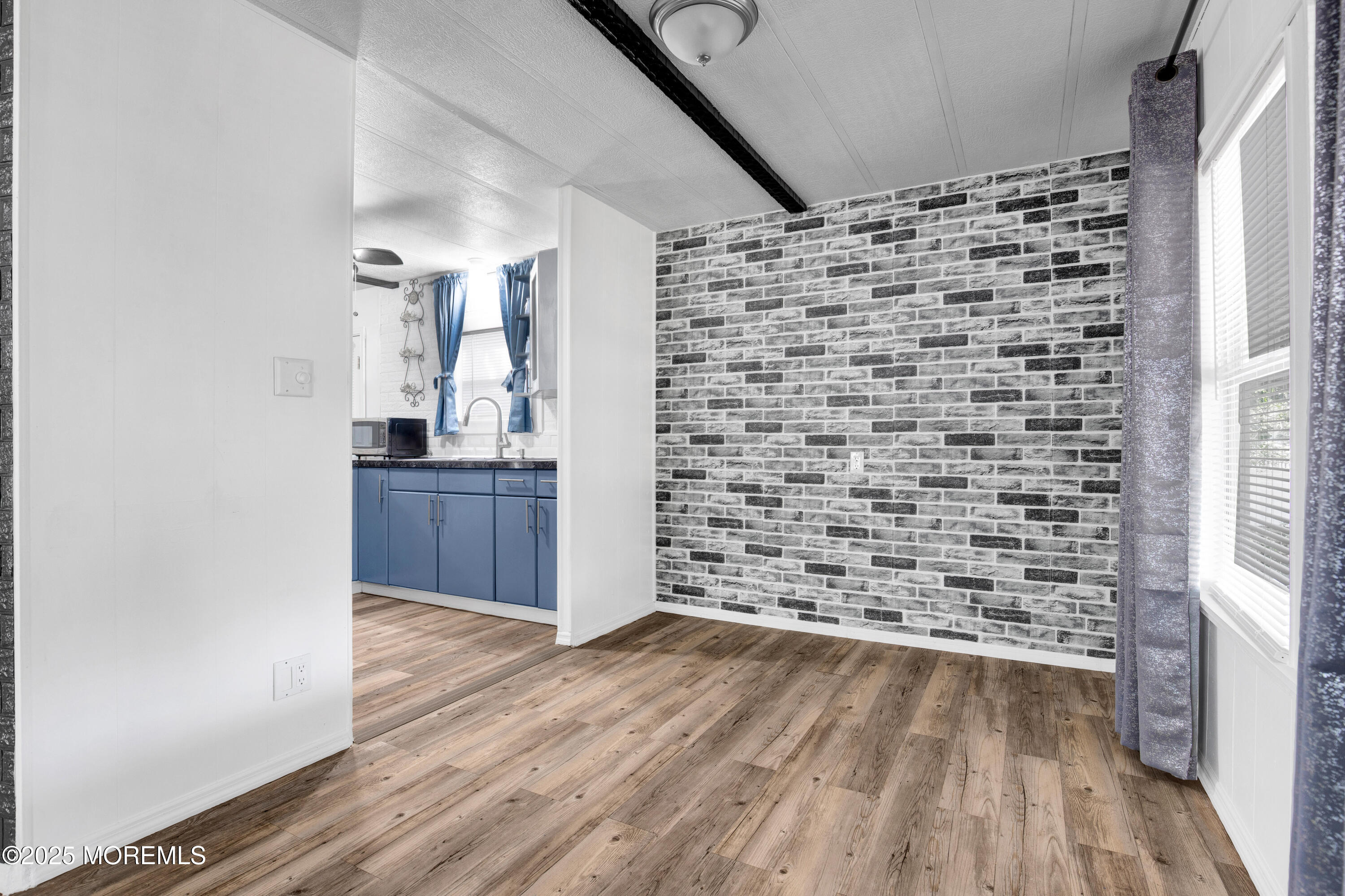 209 Mockingbird Way Whiting, NJ 08759 - Photo 7 of 26 a view of empty room with wooden floor