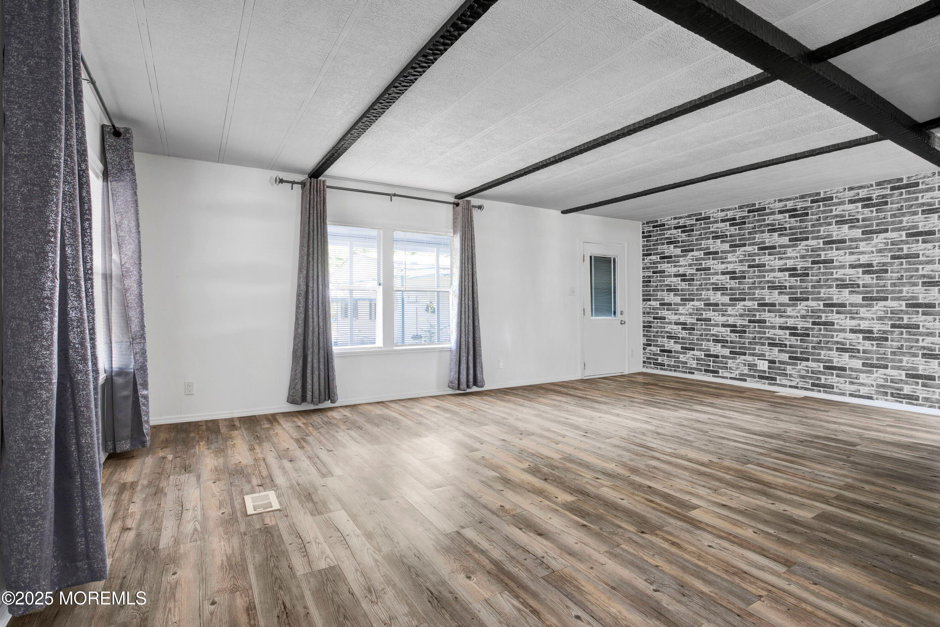 209 Mockingbird Way Whiting, NJ 08759 - Photo 8 of 26 a view of an empty room with a window