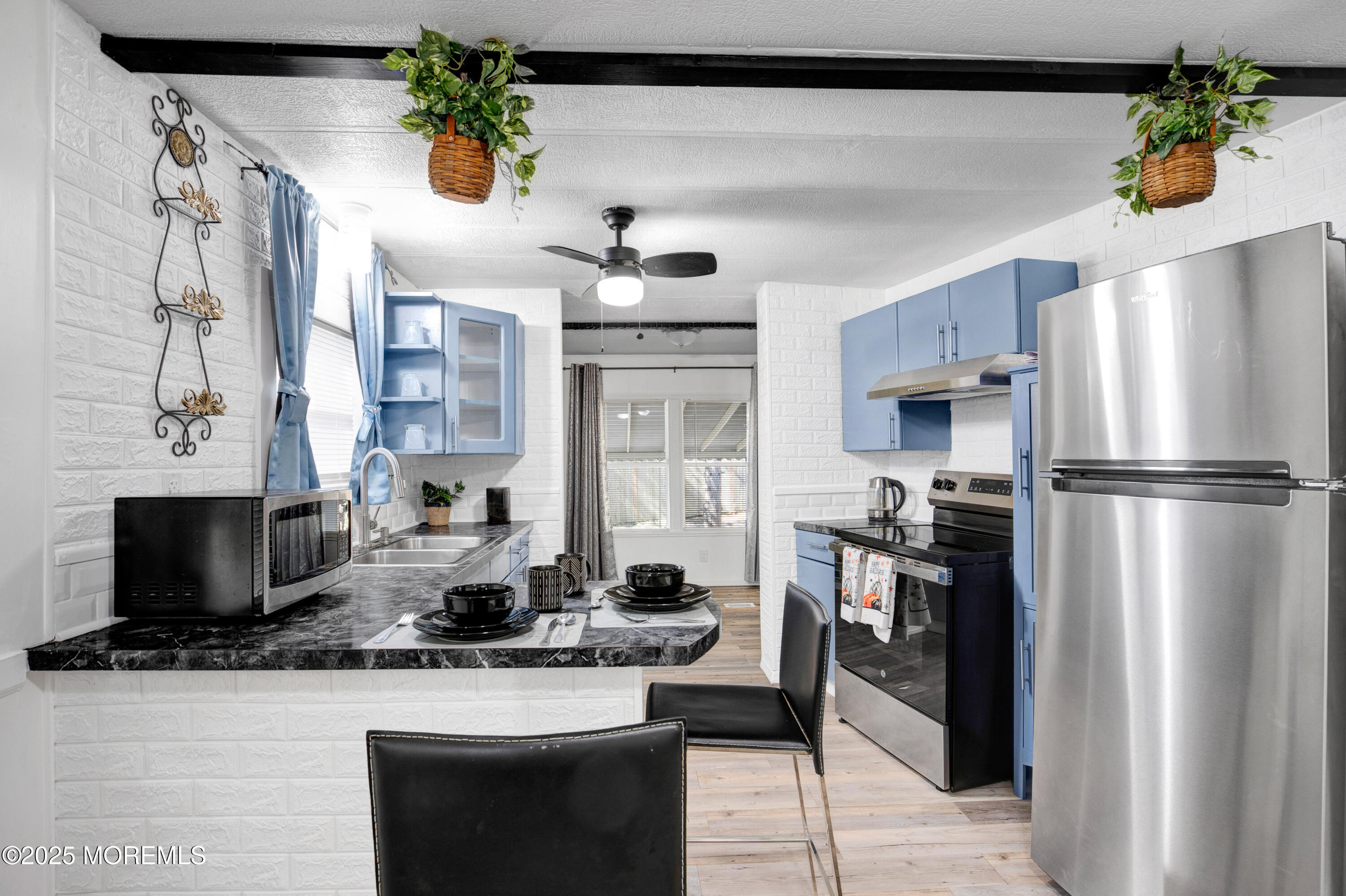 209 Mockingbird Way Whiting, NJ 08759 - Photo 9 of 26 a kitchen with stainless steel appliances granite countertop a refrigerator a stove and a sink