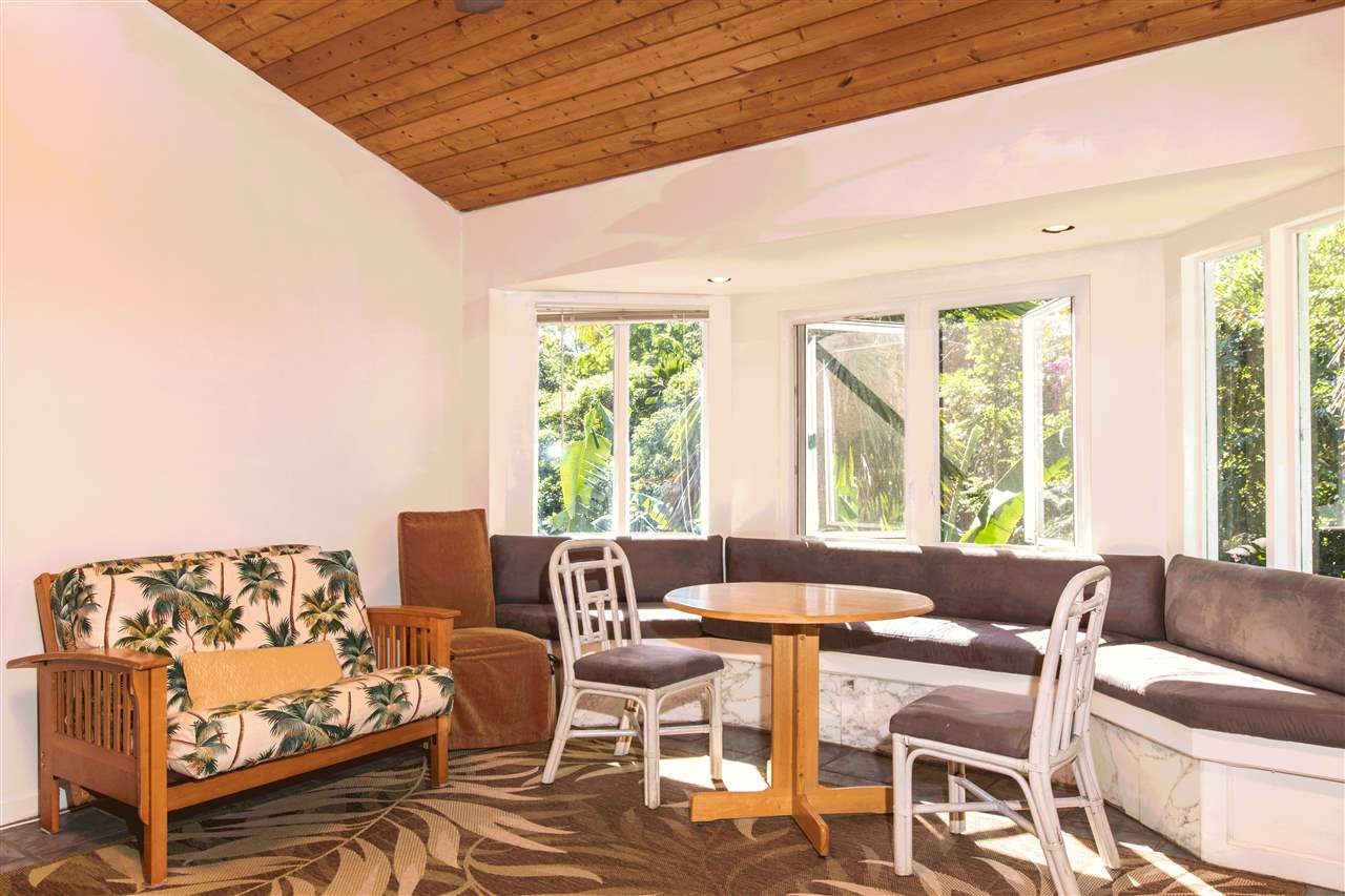 900 Haiku Road Haiku, HI 96708 - Photo 13 of 15 a living room with furniture and a large window
