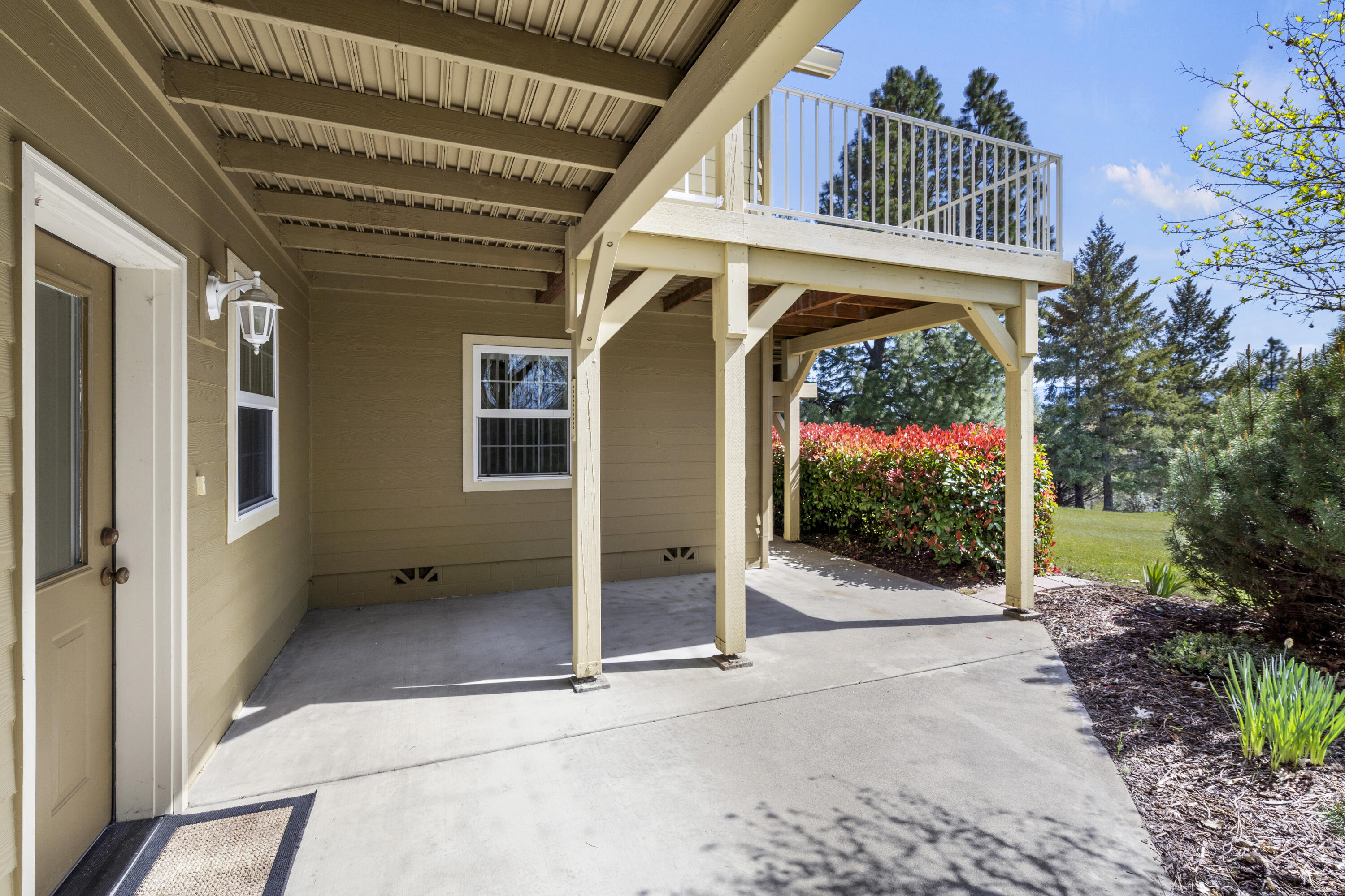 4874 Upper River Road Grants Pass, OR 97526 - Photo 8 of 66 a view of a house with a porch