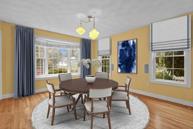 a view of a dining room with furniture and window