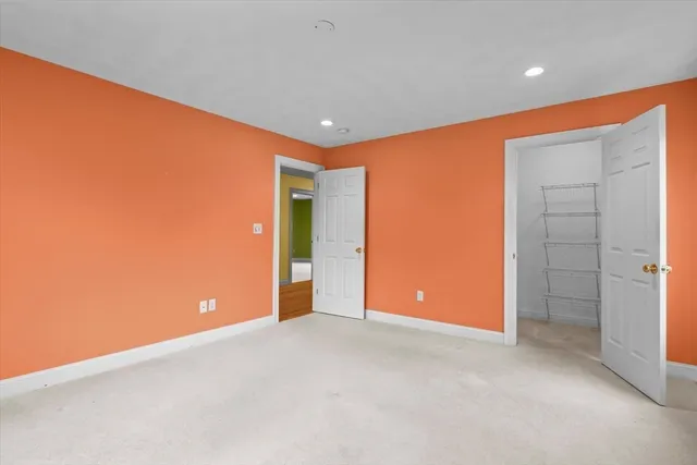 an empty room with closet area
