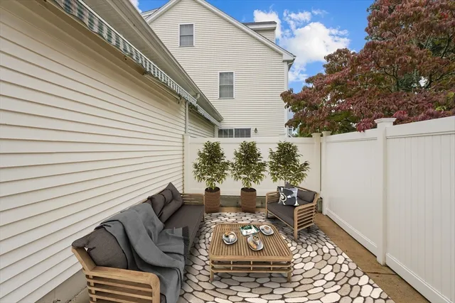 a view of a patio with couches and potted plants