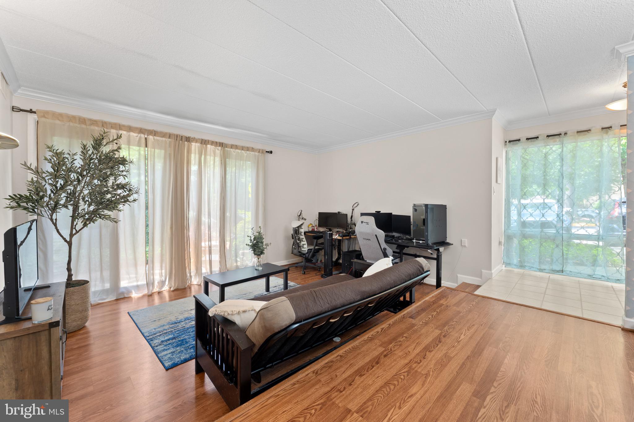 11617 Windbluff Court, Unit 9B Reston, VA 20191 - Photo 10 of 46 Living room with glass sliding doors