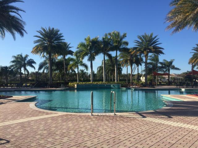 388 Springview Loop Port St. Lucie, FL 34986 - Photo 47 of 60 cascades pool with palm trees