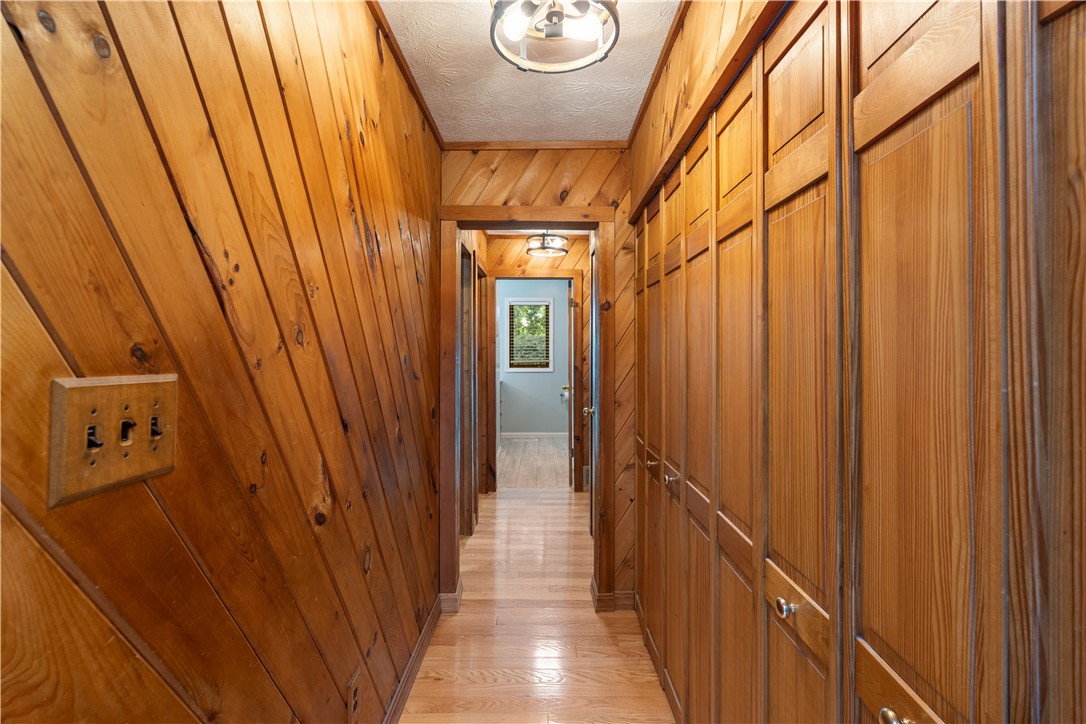 301 Spring Street Avon, NY 14414 - Photo 10 of 50 Entrance hallway to first floor bedrooms, Walkin shower, cedar closets