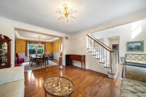 a living room with furniture and a table with kitchen view