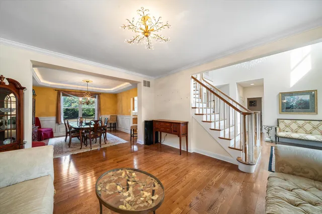 a living room with furniture and a table with kitchen view