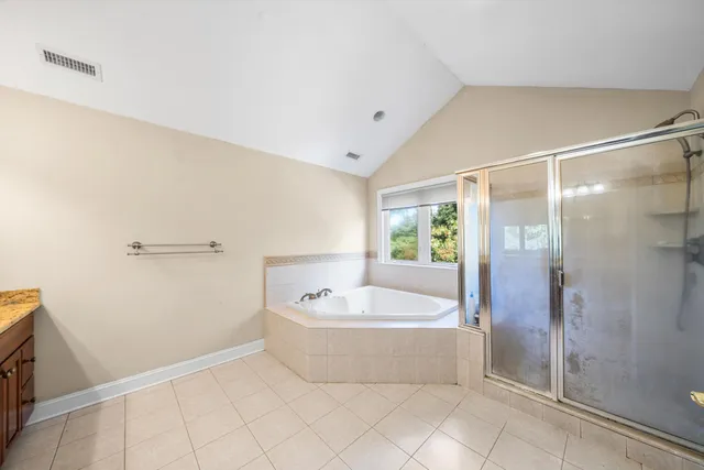 a bathroom with a bathtub and shower