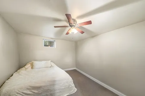 a view of a room with a fan and a fan