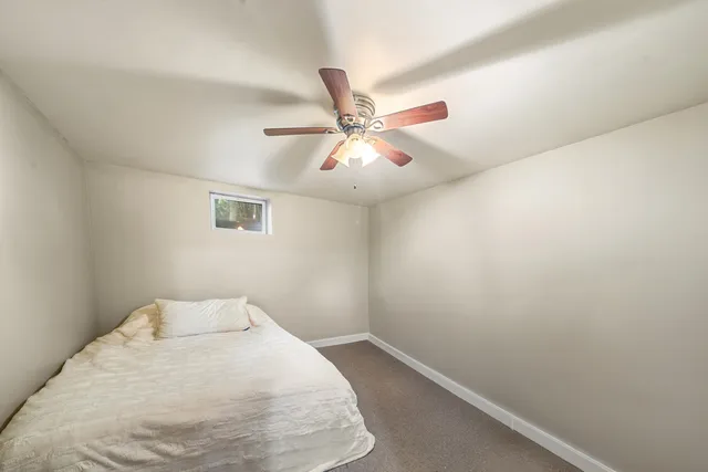 a view of a room with a fan and a fan