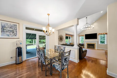 a view of a dining room with furniture window and wooden floor