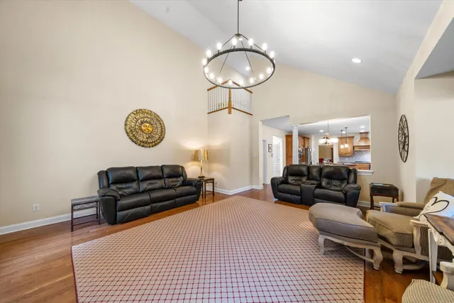 a bedroom with a bed a couch and dresser