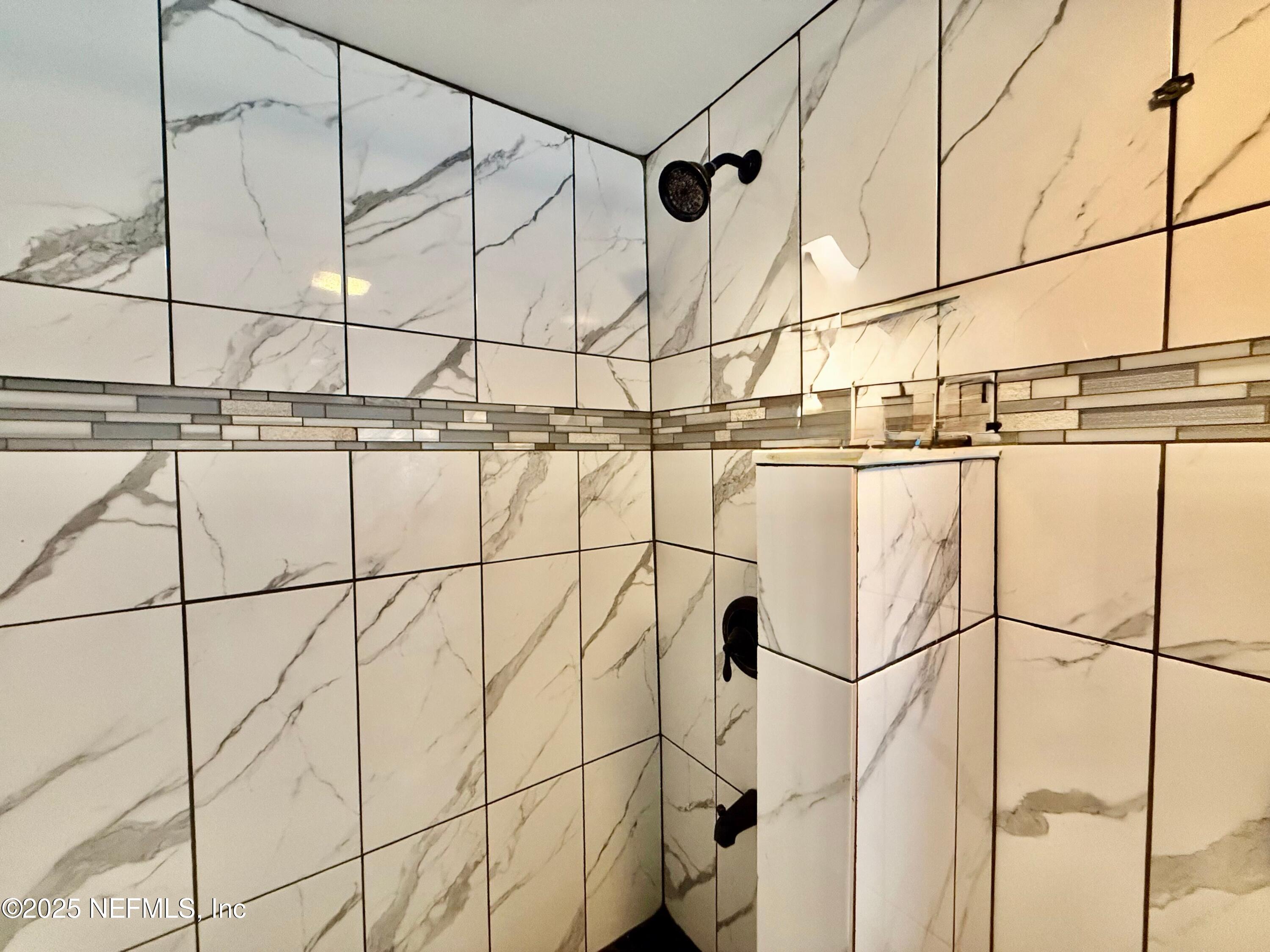 239 Pine Tree Trail Crescent City, FL 32112 - Photo 12 of 21 a bathroom with a shower