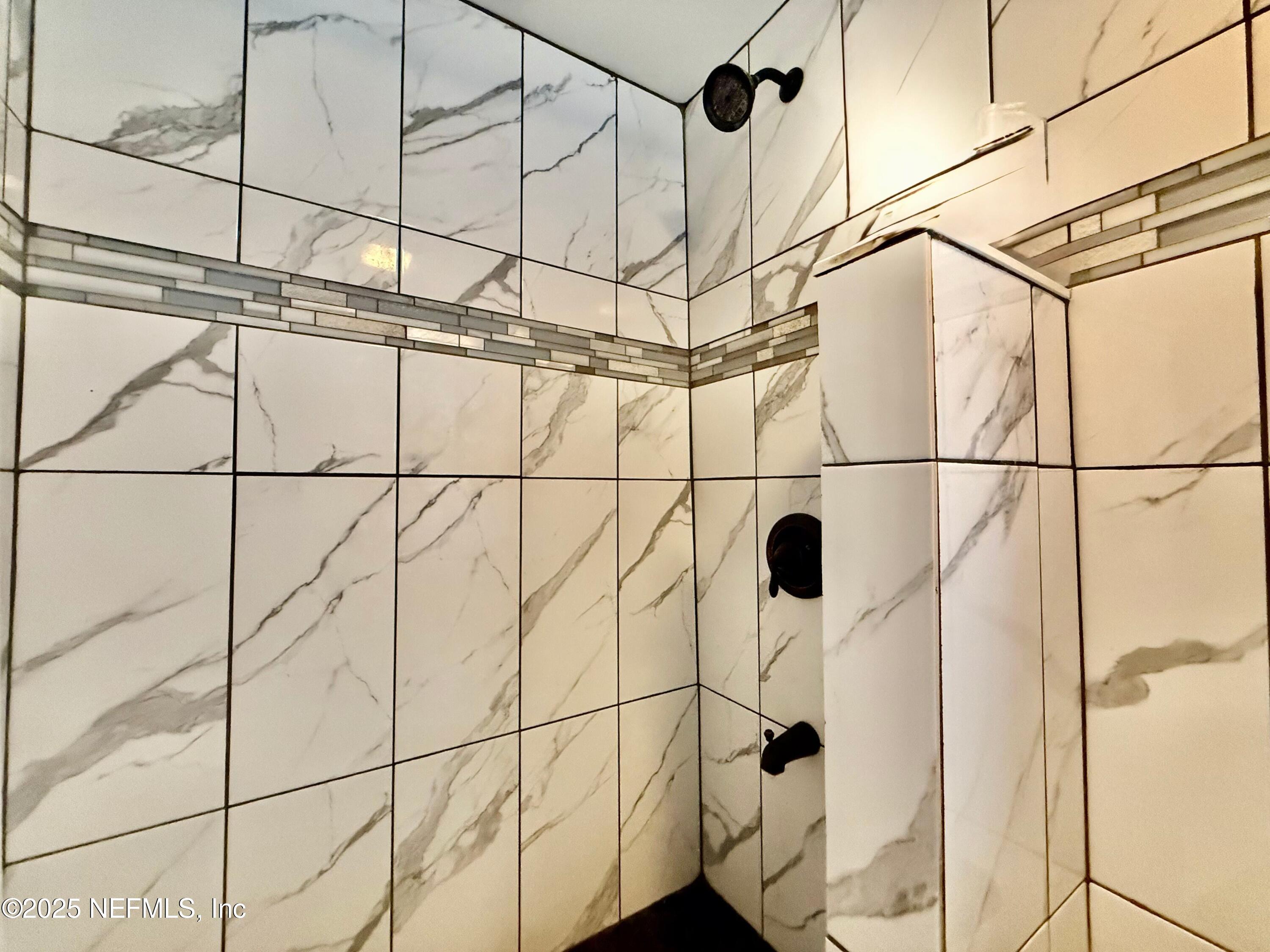 239 Pine Tree Trail Crescent City, FL 32112 - Photo 13 of 21 a bathroom with a shower