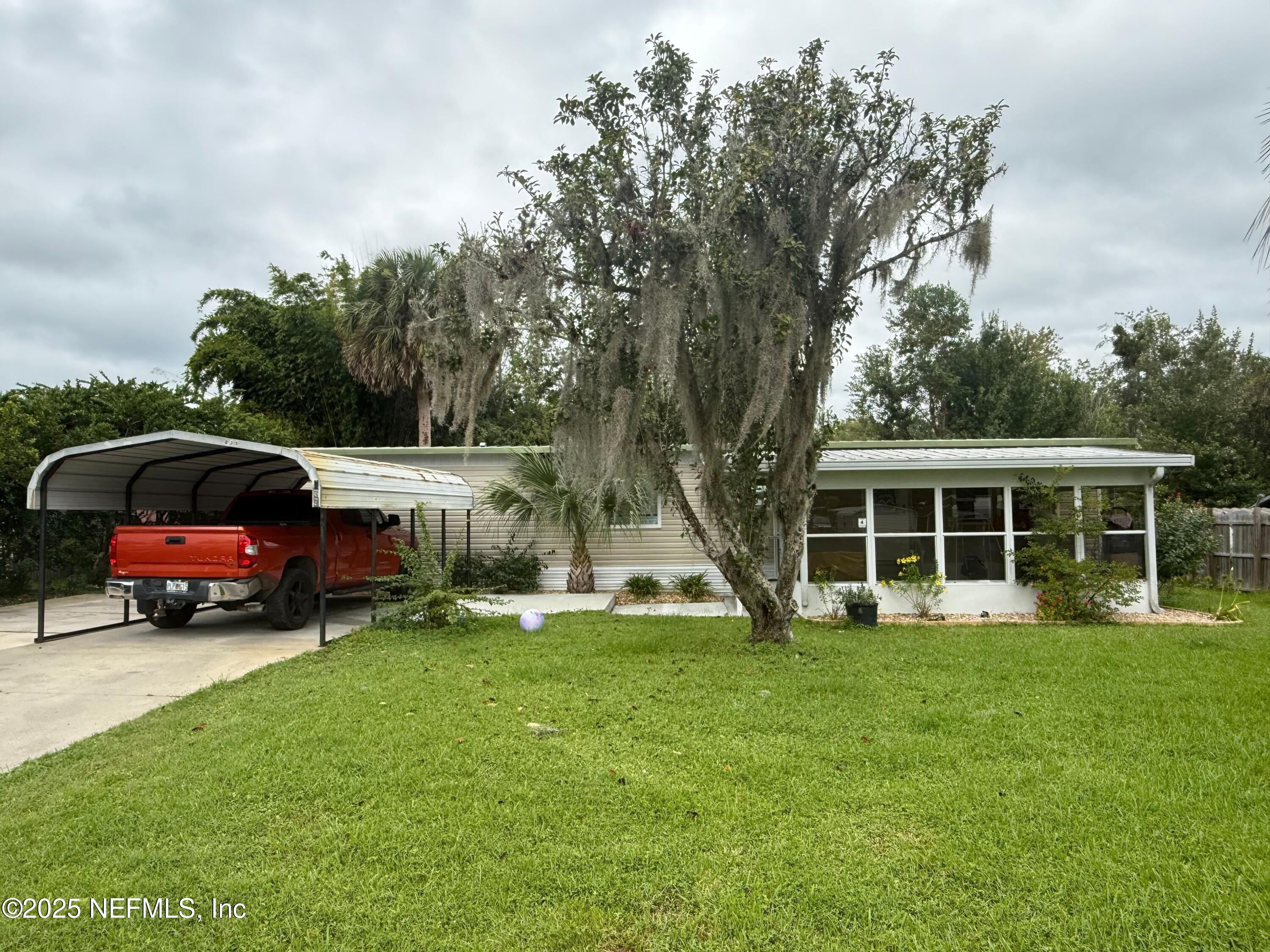 239 Pine Tree Trail Crescent City, FL 32112 - Photo 2 of 21 a house view with a garden space