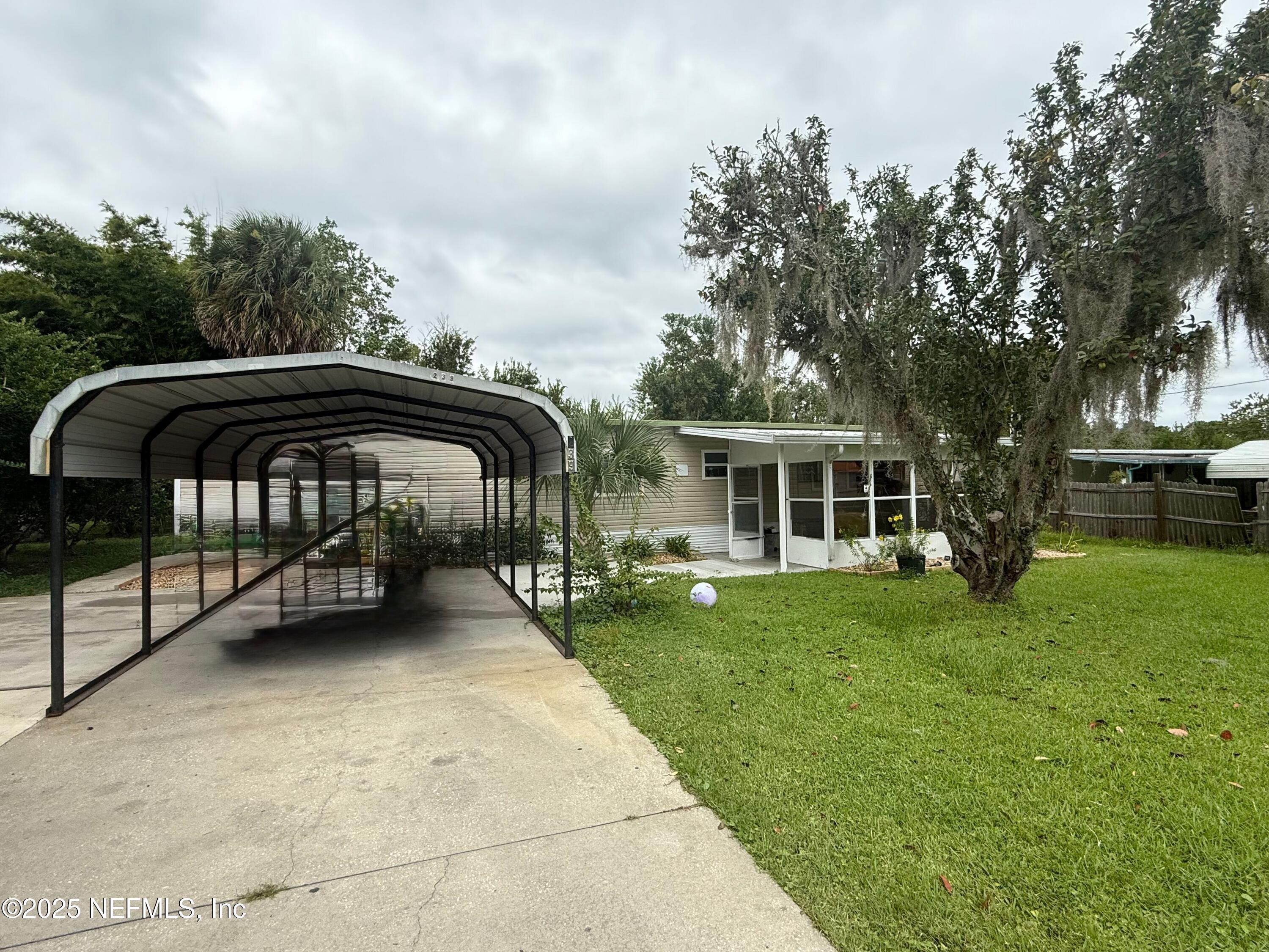 239 Pine Tree Trail Crescent City, FL 32112 - Photo 3 of 21 a view of a yard with furniture and garden