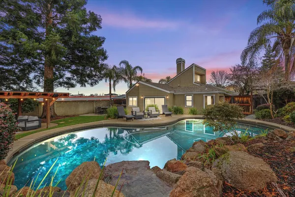 a front view of a house with swimming pool