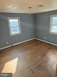 an empty room with windows