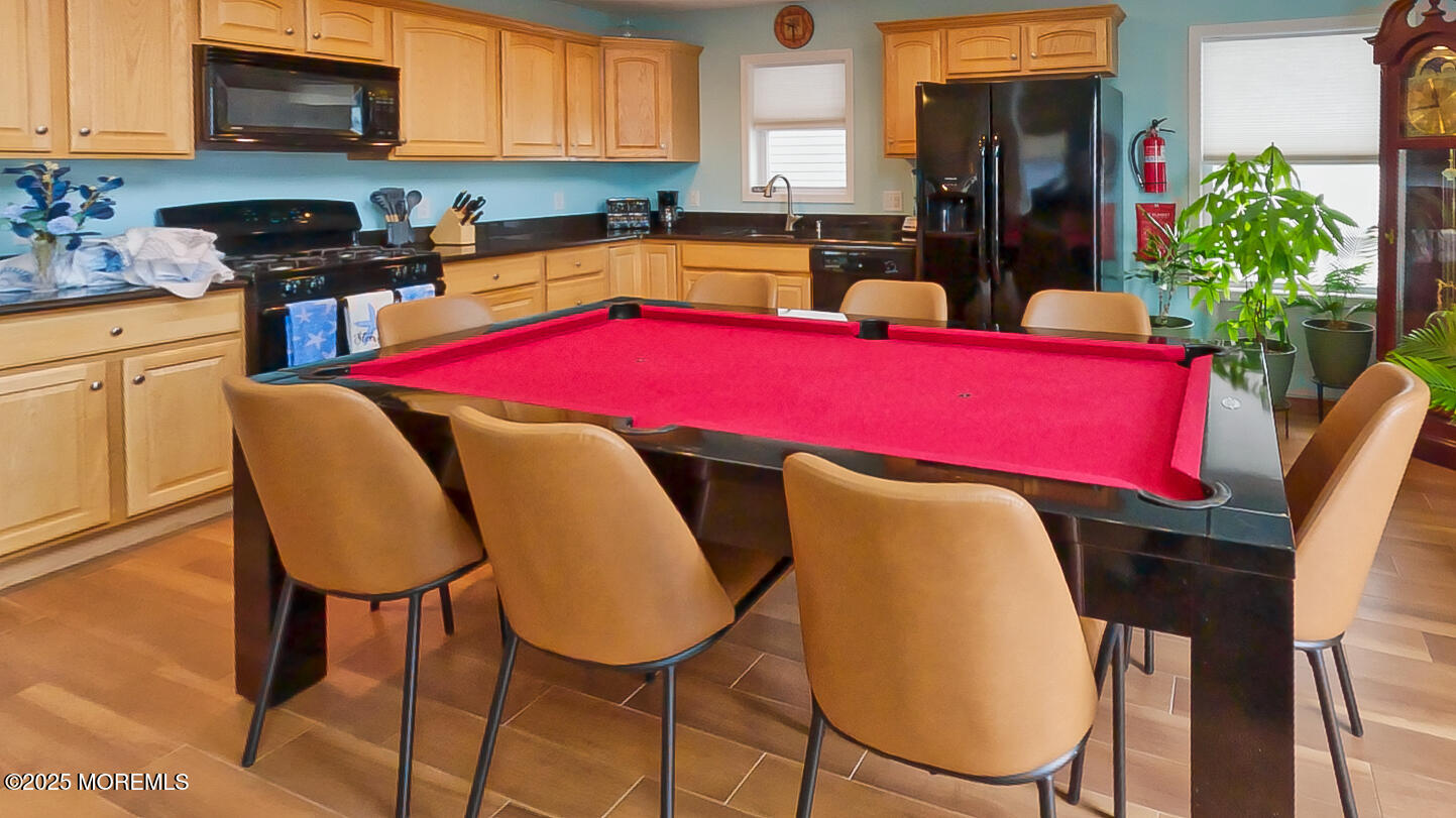 45 Sylvia Lane Manahawkin, NJ 08050 - Photo 12 of 36 a view of a dining room with furniture and a kitchen
