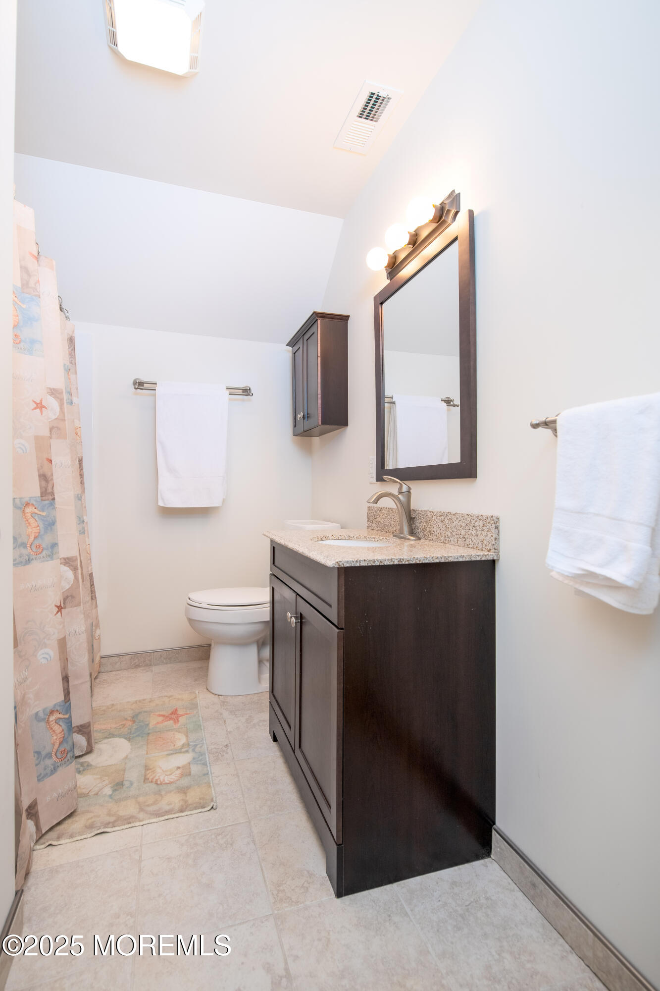 45 Sylvia Lane Manahawkin, NJ 08050 - Photo 14 of 36 a bathroom with a sink toilet and mirror