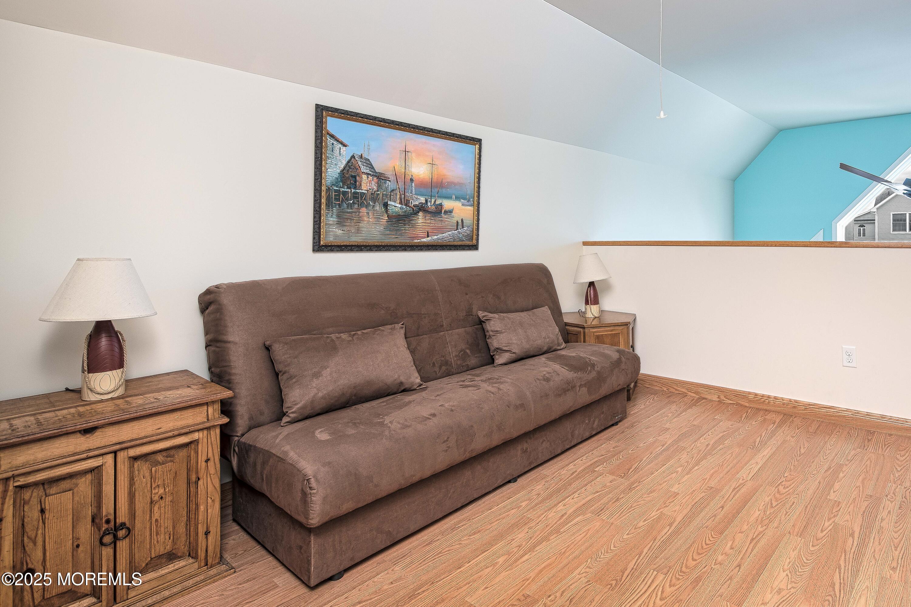 45 Sylvia Lane Manahawkin, NJ 08050 - Photo 15 of 36 a living room with furniture and a lamp