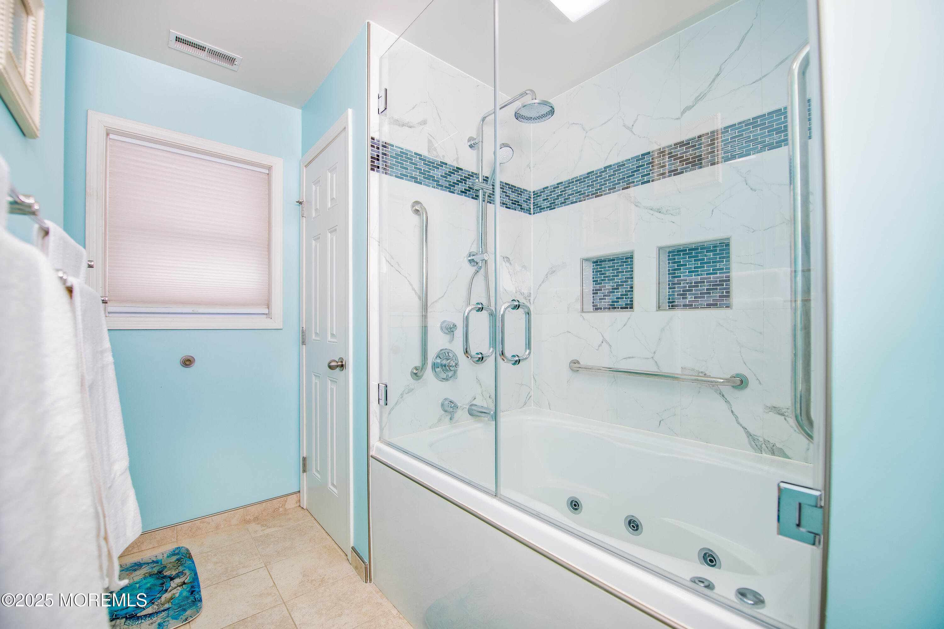45 Sylvia Lane Manahawkin, NJ 08050 - Photo 19 of 36 a bathroom with a bathtub a shower and a sink