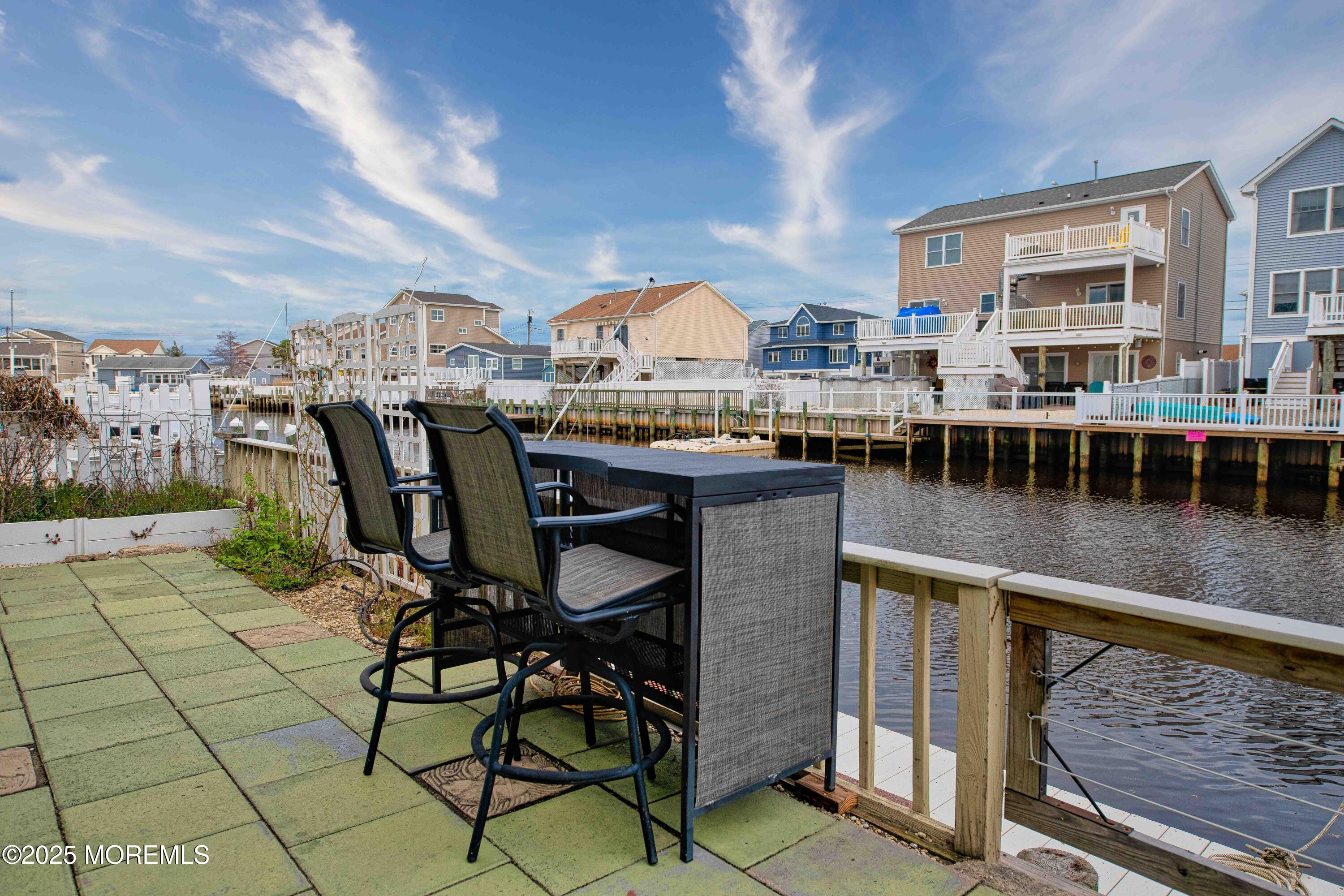 45 Sylvia Lane Manahawkin, NJ 08050 - Photo 23 of 36 a view of a swimming pool with outdoor seating and plants
