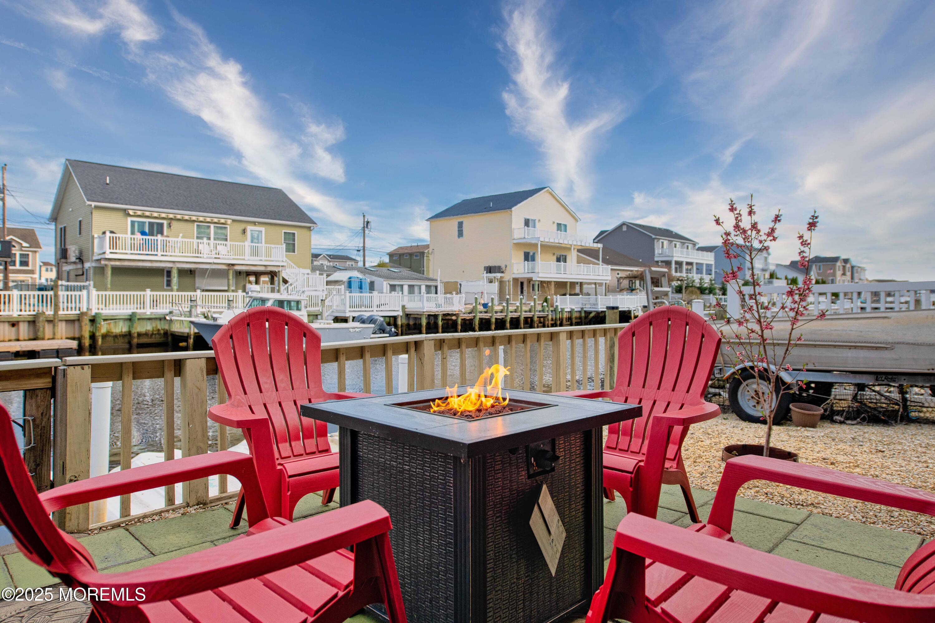 45 Sylvia Lane Manahawkin, NJ 08050 - Photo 31 of 36 a view of a dining room with furniture one side kitchen view and wooden floor