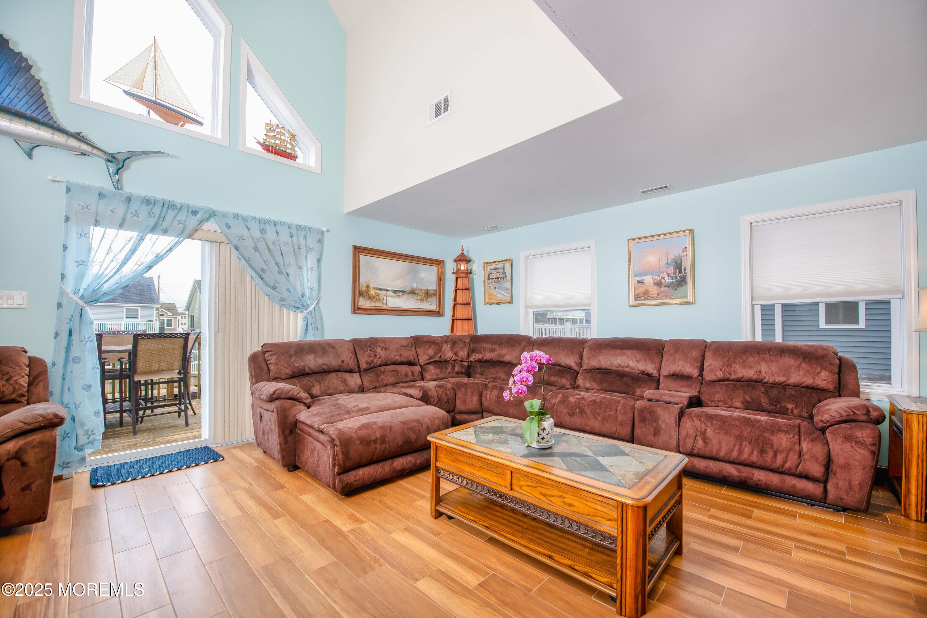 45 Sylvia Lane Manahawkin, NJ 08050 - Photo 6 of 36 a living room with furniture and a wooden floor