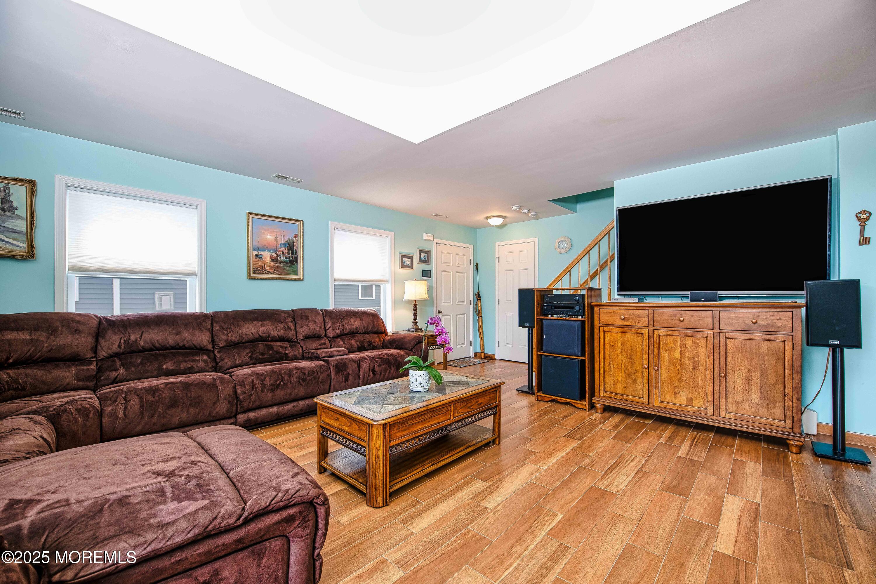 45 Sylvia Lane Manahawkin, NJ 08050 - Photo 7 of 36 a living room with furniture and a flat screen tv