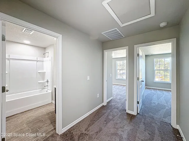 an empty room with windows