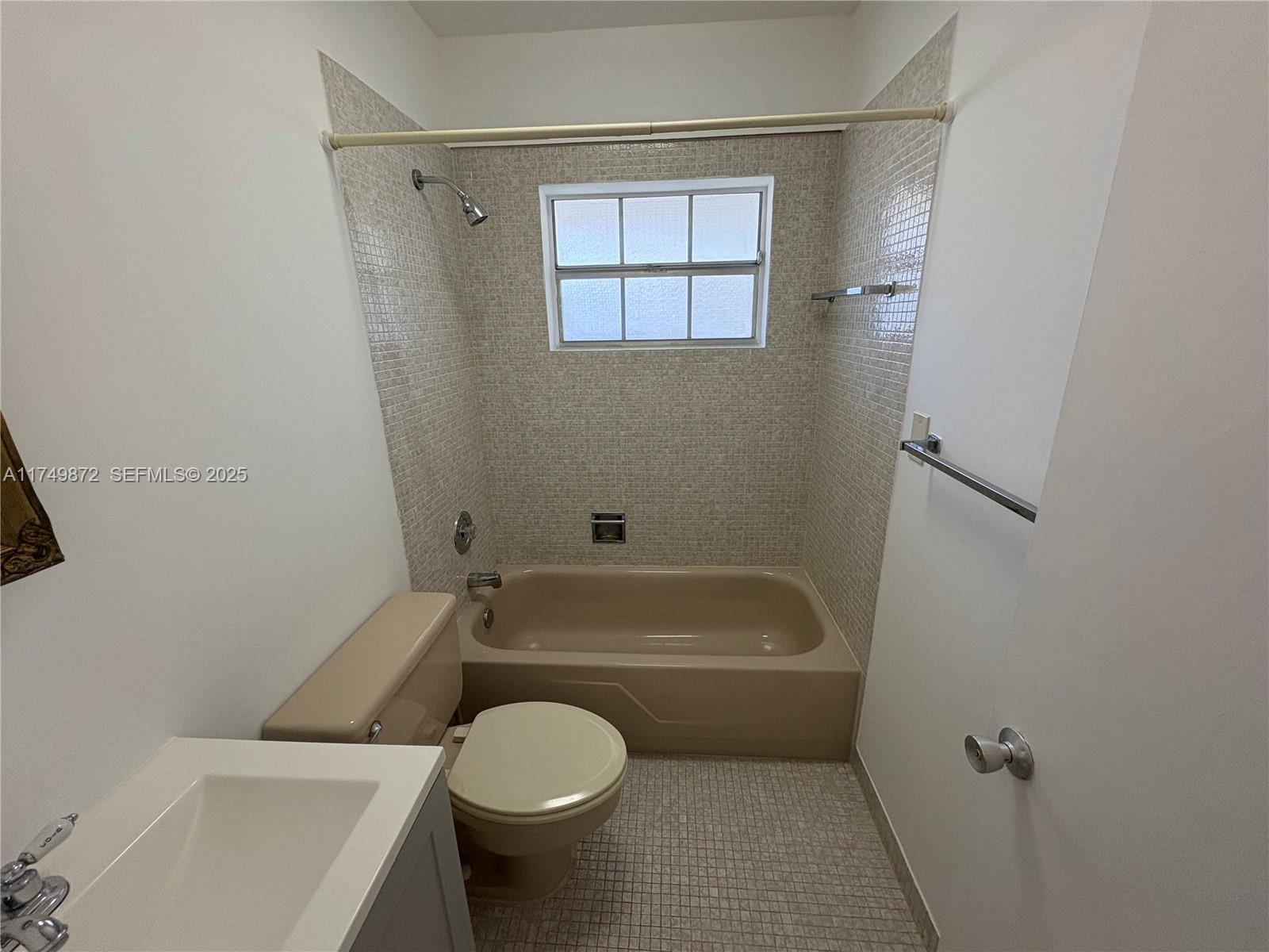 11260 Southwest 172nd Street, Unit II2831 Miami, FL 33157 - Photo 12 of 24 a bathroom with a toilet and white tub