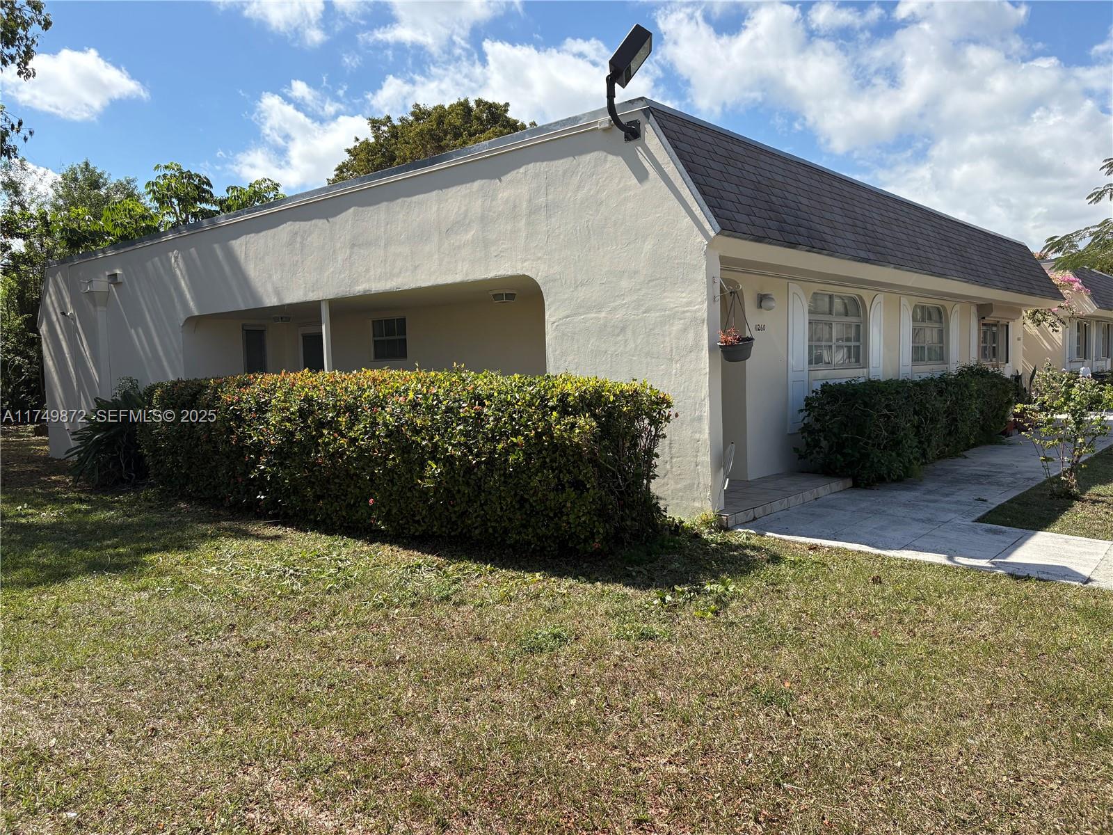 11260 Southwest 172nd Street, Unit II2831 Miami, FL 33157 - Photo 2 of 24 a view of a house with a yard