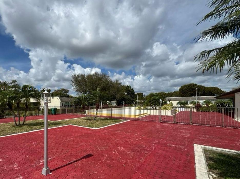 11260 Southwest 172nd Street, Unit II2831 Miami, FL 33157 - Photo 22 of 24 a view of a playground with basketball court