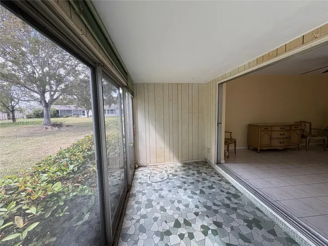 a view of a room with a large window