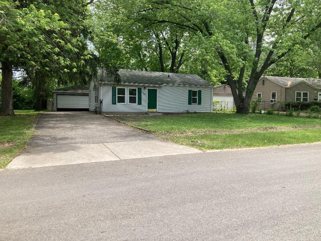 130 Edison Road Joliet, IL 60433 - Photo 1 of 9 a house with trees in front of it