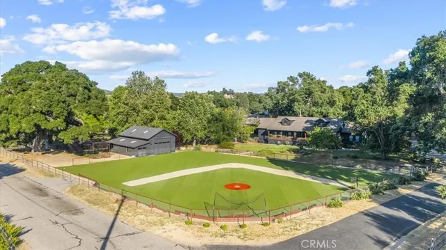 a view of a swimming pool with a yard