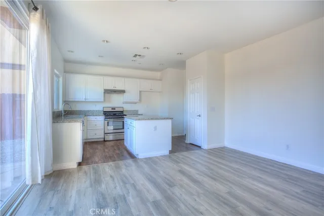 a view of a kitchen with wooden floor