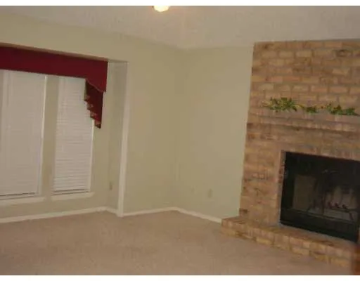 a living room with a fireplace