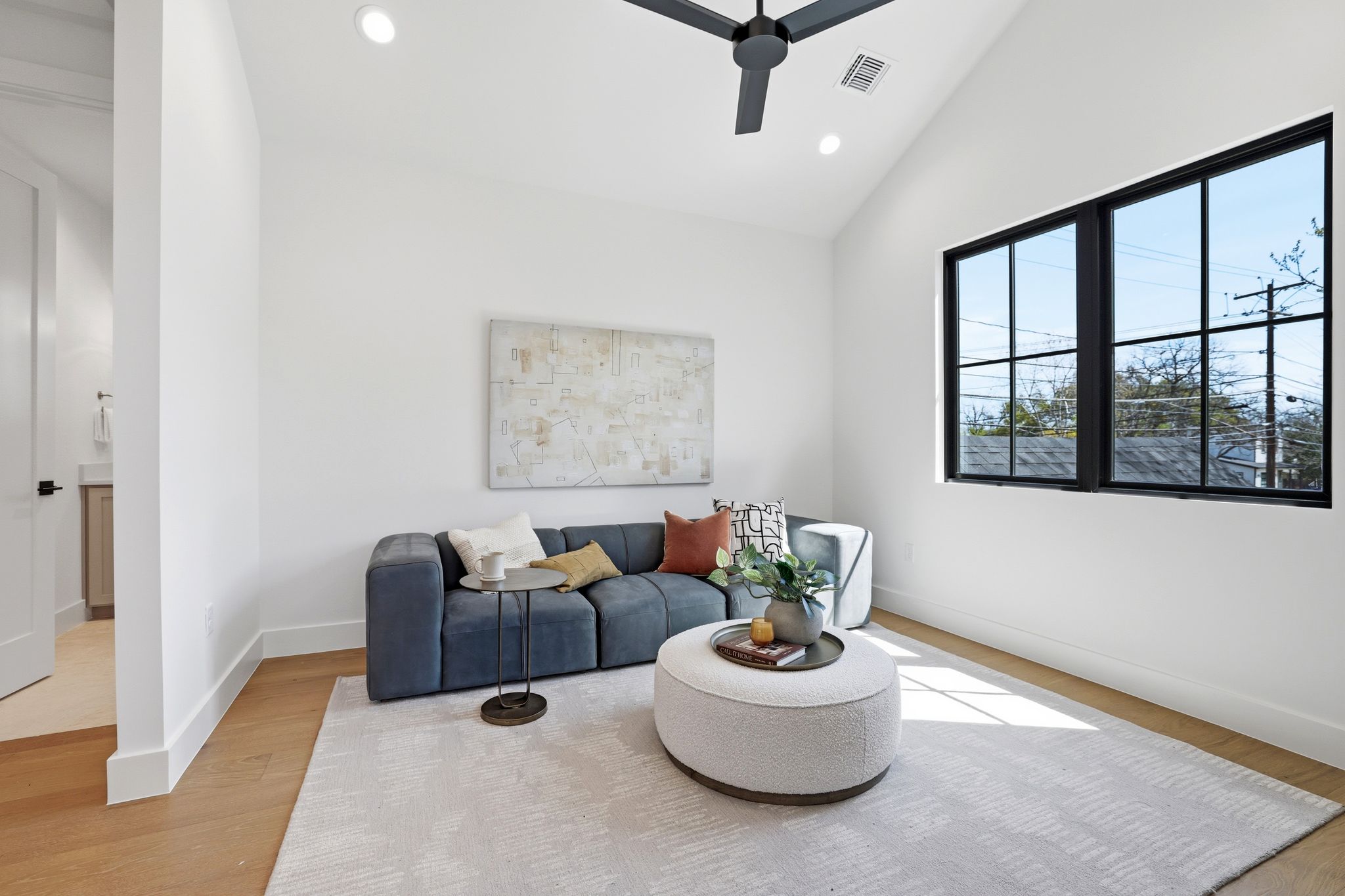 4500 Jinx Avenue Austin, TX 78745 - Photo 27 of 40 Living area featuring a ceiling fan, recessed lighting, lofted ceiling, and light wood finished floors