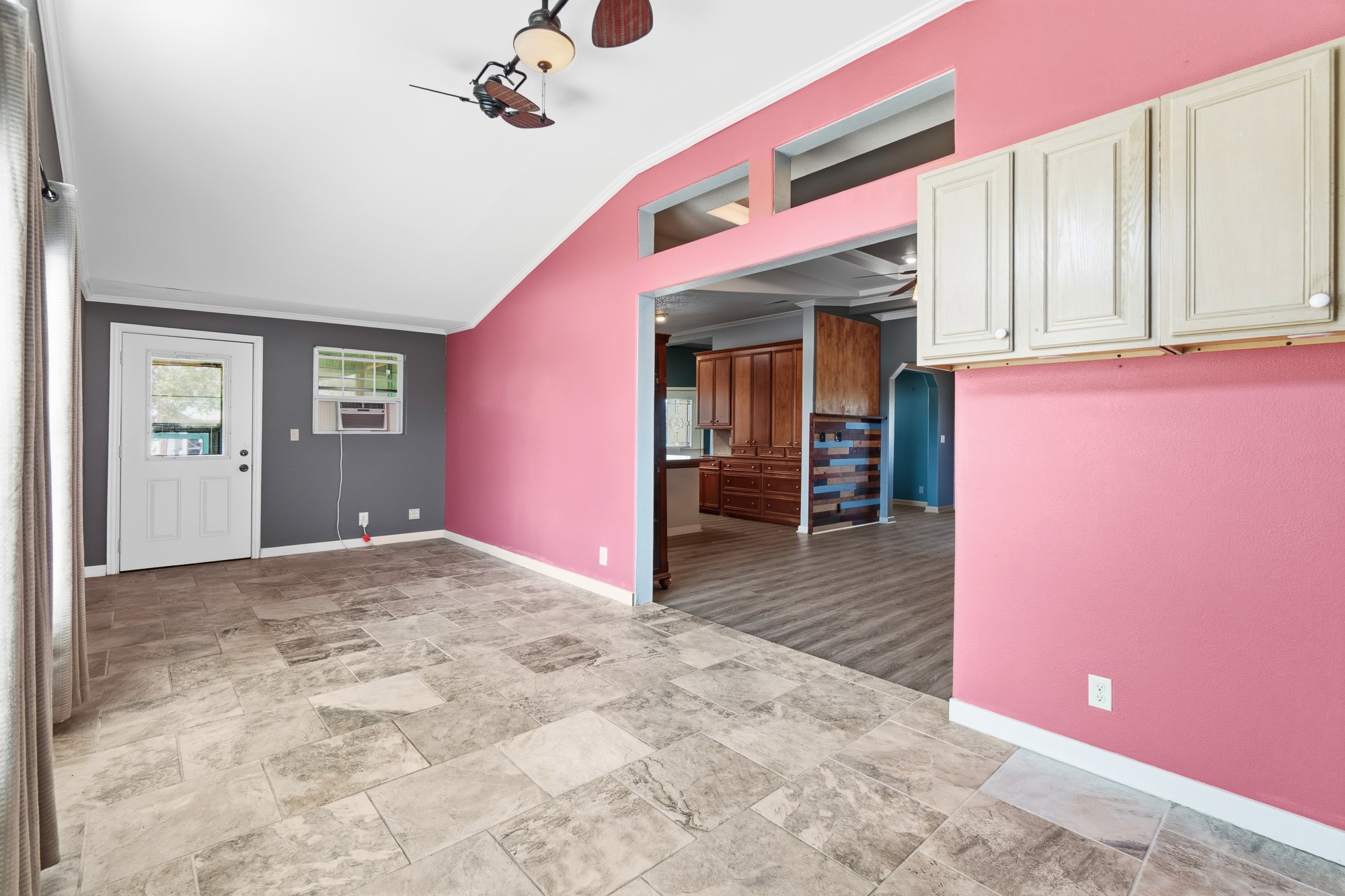 1951 Dowdy Road Seguin, TX 78155 - Photo 7 of 40 An open doorway connects the tiled living space to the adjacent wood-floored dining area.