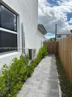 834 Southeast 26th Street, Unit STUDIO Homestead, FL 33035 - Photo 2 of 11 a view of a pathway with a yard