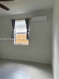 834 Southeast 26th Street, Unit STUDIO Homestead, FL 33035 - Photo 8 of 11 a view of an empty room with a window