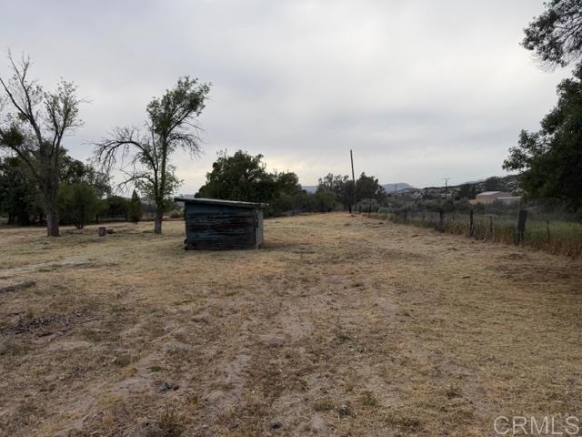 1366 Far Valley Road Campo, CA 91906 - Photo 17 of 26 a view of a dry yard with wooden fence