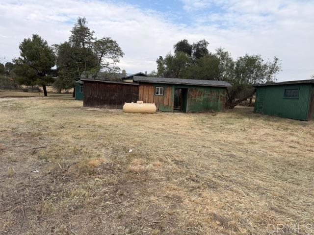 1366 Far Valley Road Campo, CA 91906 - Photo 21 of 26 a backyard of a house with lots of green space